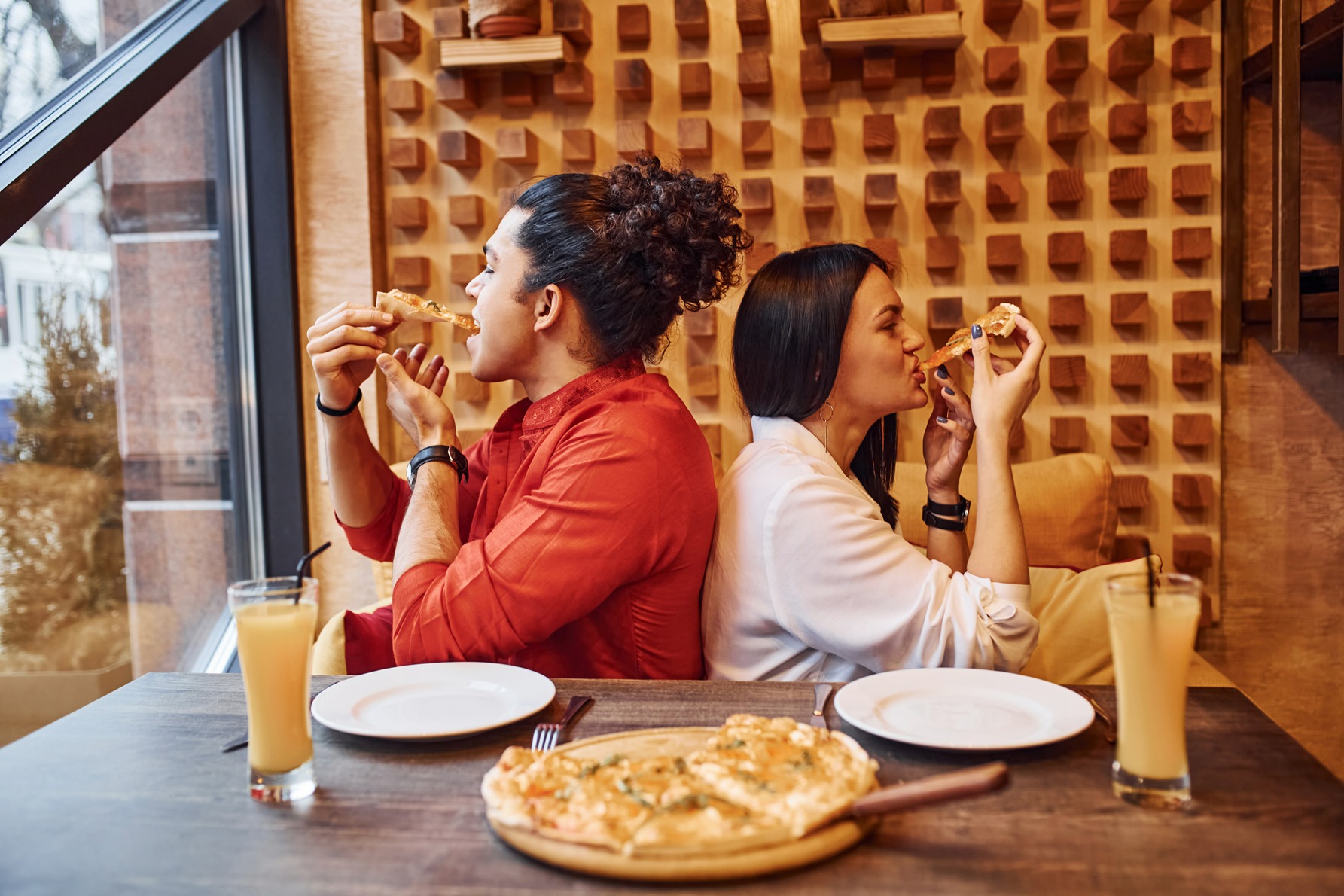 multi-ethnic-young-couple-sitting-indoors-together-2023-11-27-04-58-16-utc (1)